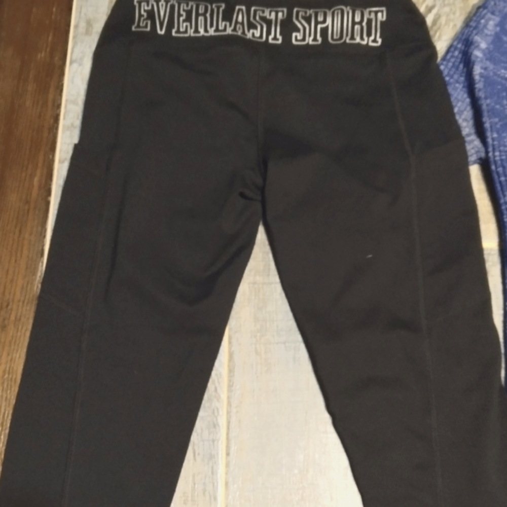 Black Everlast yoga Capri pants and blue stripe black sleeve half sleeve shirt